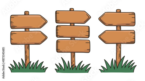A set of wooden signposts with blank boards standing in grass on a white background