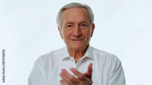 Wallpaper Mural Elderly man claps joyfully in series of frames on white background, expressing happiness and celebration Torontodigital.ca