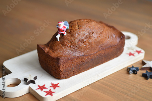 Gingerbread cake with Christmas decoration on wooden board