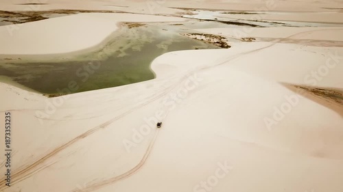 Car dune bashing in Lencois Maranhenses National Park drone view of dunes and lagoons. Maranhao, Brazil. High quality 4k footage