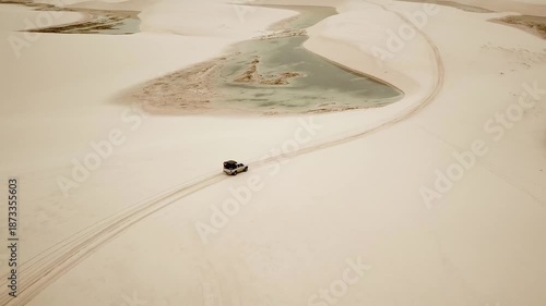 Car dune bashing in Lencois Maranhenses National Park drone view of dunes and lagoons. Maranhao, Brazil. High quality 4k footage