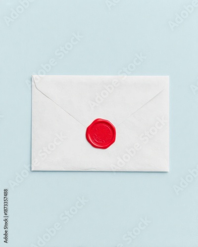 Free Download Minimal white envelope with bright red wax seal on soft blue background, symbolizing privacy, message security and elegant correspondence. - GFXLoad