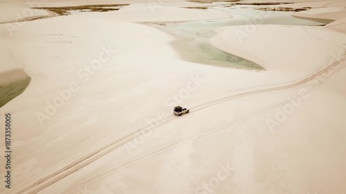 Car dune bashing in Lencois Maranhenses National Park drone view of dunes and lagoons. Maranhao, Brazil. High quality 4k footage