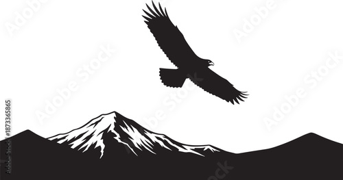 Majestic eagle soaring over a snow-capped mountain peak silhouette in the wilderness.
