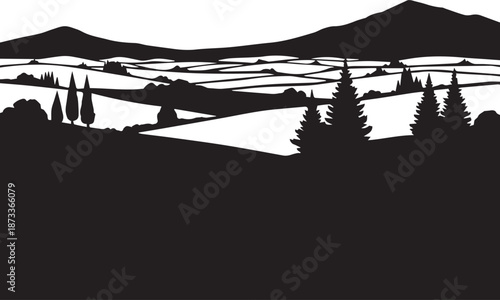Serene landscape with rolling hills and trees in silhouette