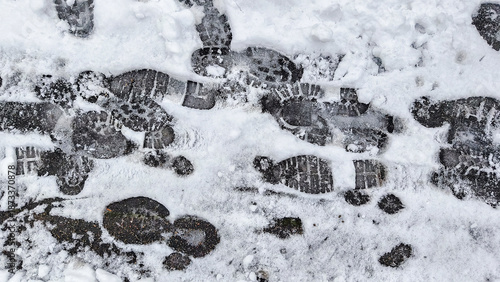 Wallpaper Mural Footprints in the snow on a sidewalk showing the texture of the ground beneath Torontodigital.ca