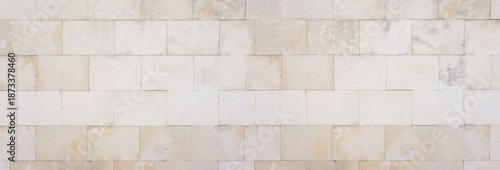 Fotografia Light stone wall blocks surface texture background