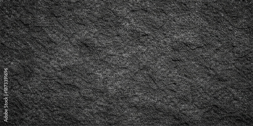 A seamless dark macro wallpaper featuring a closeup of rough black leather and textured fabric material with a gray stone pattern surface