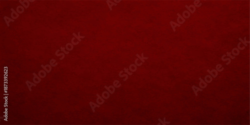 Vintage red grunge paper texture with a dark patterned design on a blank weathered surface creates a retro fabric and leather material backdrop for Christmas wallpaper