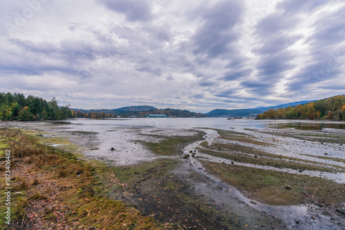 Low tide at Burrard Inlet on a cloudy winter day as viewed from Shoreline Trail at Port Moody, BC.