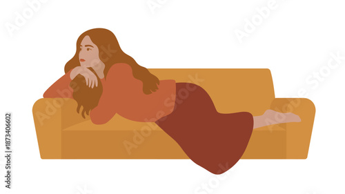 A woman lies on a couch looking relaxed and at ease.