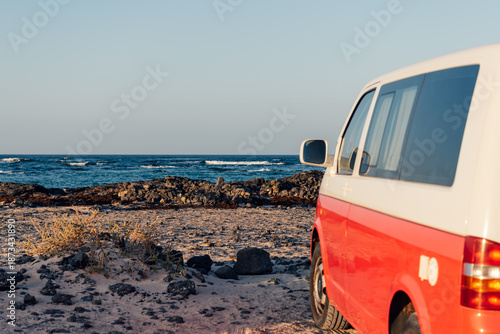 Vintage van parked by the ocean at golden hour in Fuerteventura