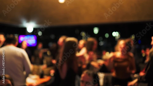 Wallpaper Mural An enjoyable night spent with companions sharing happy discussions beneath warm amber illumination Torontodigital.ca