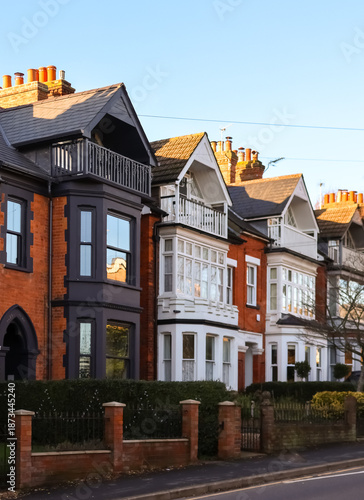 Victorian terraced houses lining residential street in Hemel Hempstead, England, showing classic brick architecture and bay windows