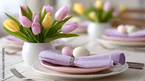 Elegant easter table setting with pastel decorations and spring flowers for festive dining