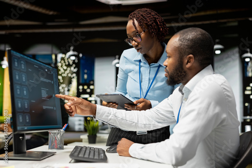 Quadro em tela Team of black IT experts use online AI assistant to automate text generation and solve daily tasks, enhance productivity at the office
