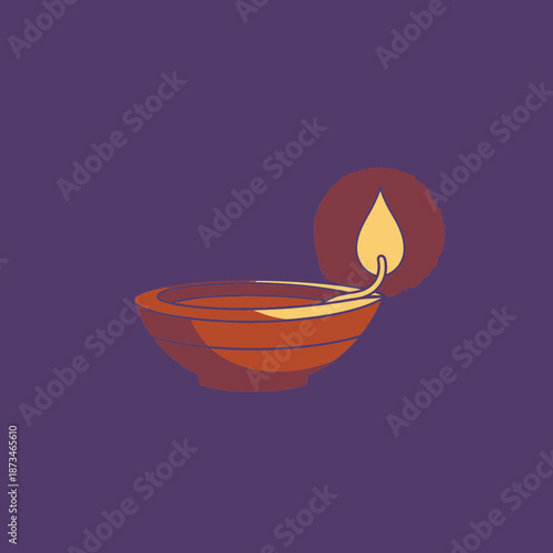 Lit diya oil lamp with flame for celebration or decoration.