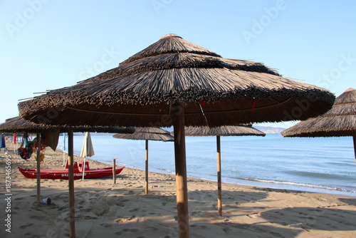 Beautiful scenic view of a wild and empty sandy beach in Albinia, Maremma region, Grosseto province, Tuscany, Italy. Blue sea and Mediterranean coastline under a clear sky.