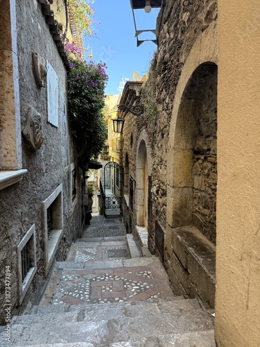 Narrow stone staircase in a historic European alley