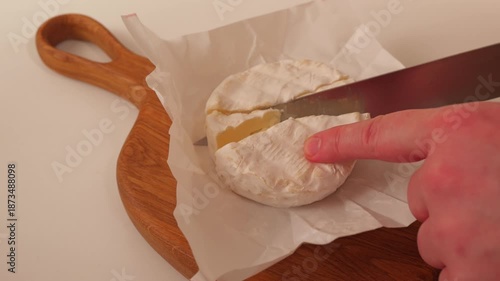 Cut cheese on a white paper