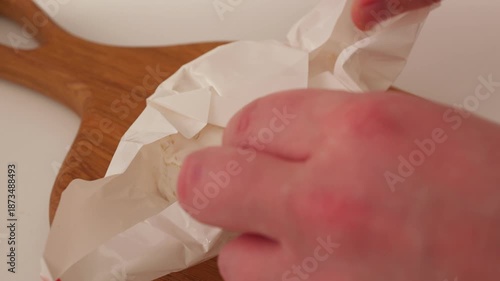 Cut cheese on a white paper