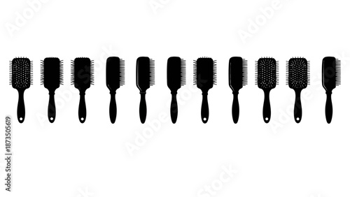 A row of hairbrushes isolated on a white background in a pattern.