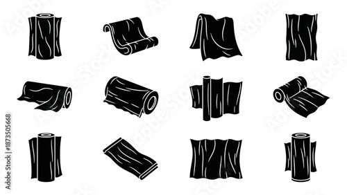 Set of black fabric rolls in various positions on a white background.