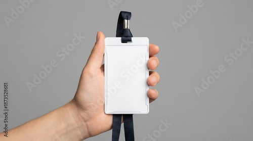 A person's hand gracefully presents a blank id card. It is perfect for illustrating security, access control, and corporate identity.