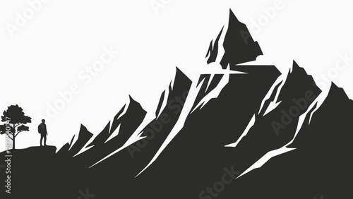 A lone traveler standing near trees at the base of a majestic mountain range