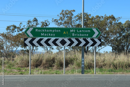 Directional sign pointing towards Rockhampton, Mackay, Mt Larcom and Brisbane on the Bruce Highway in Queensland, Australia