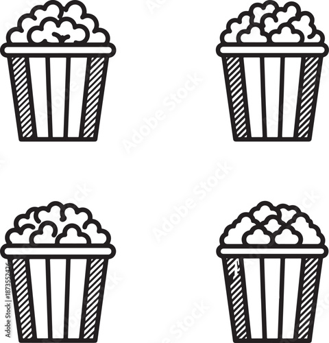 Four black and white popcorn buckets filled with popcorn