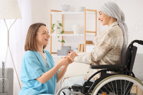 Young woman in wheelchair a...