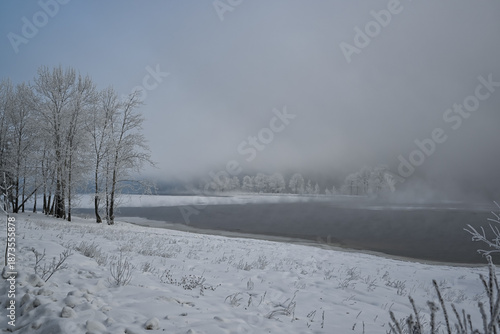 fog over the riverbank in winter