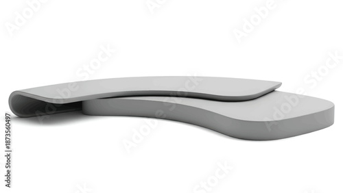 Two smooth curved overlapping gray platforms forming a layered abstract minimalist sculpture artwork