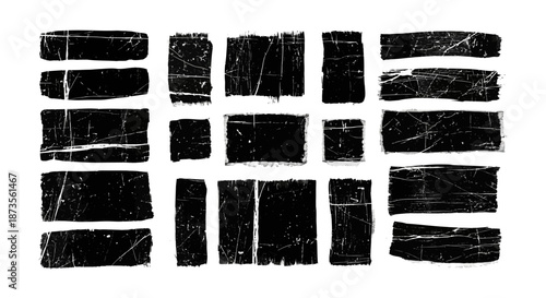 Collection of black grunge brush strokes on white background.