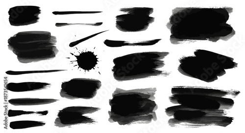 Collection of black brush strokes and smudges on white background.