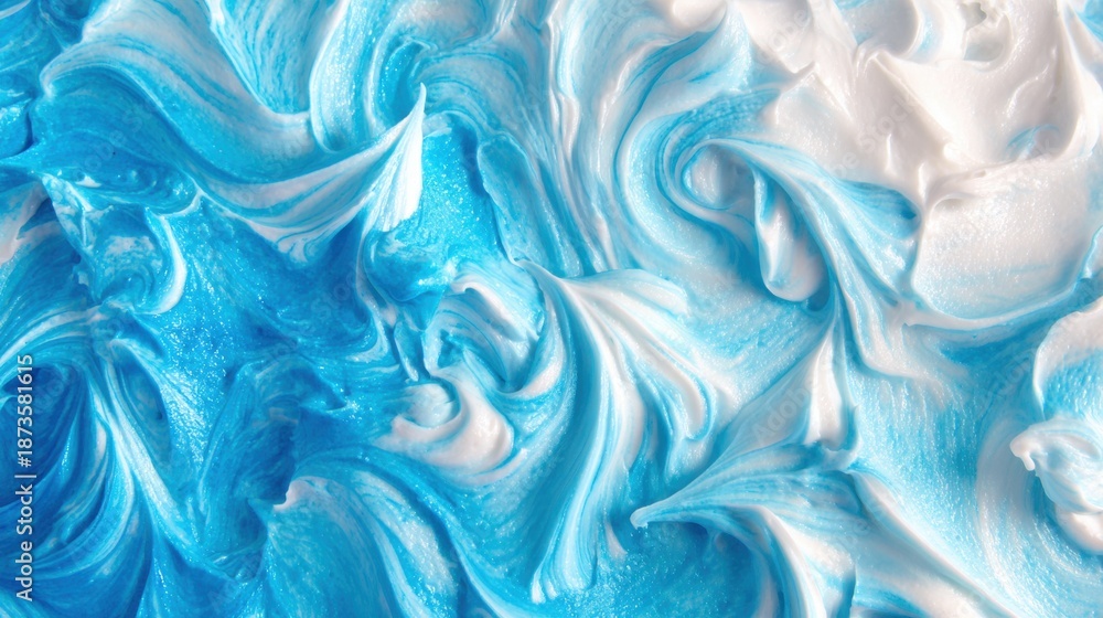 Fototapeta premium Swirls of blue and white cream on a smooth surface in bright light