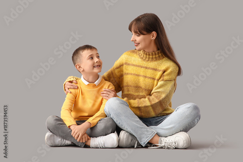 Happy mother hugging her li...