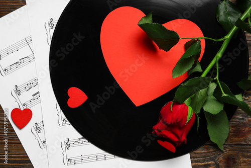 Vinyl disk with rose, note ...