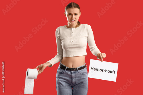 Young woman holding paper w...