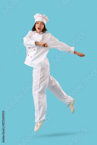 Shocked female chef jumping...