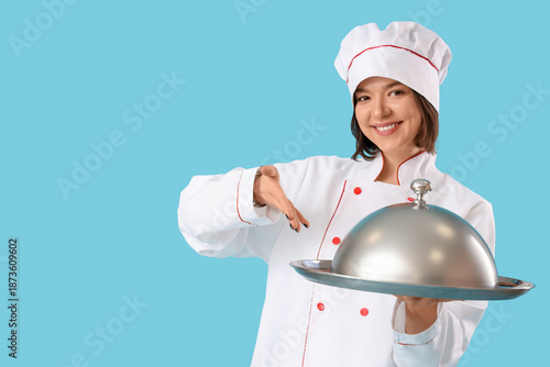 Female chef with cloche on ...