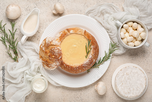 Cheese soup in bread bowl w...