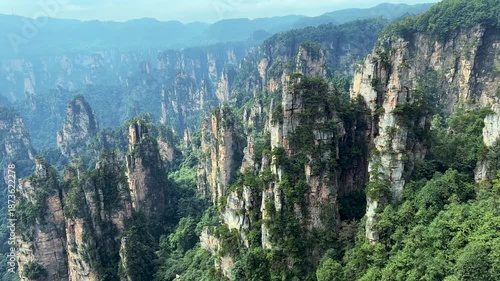 Stunning 4K UHD aerial and time-lapse footage of Zhangjiajie’s Wulingyuan Scenic Area, a world-famous tourist attraction renowned for its dramatic quartz sandstone peaks.