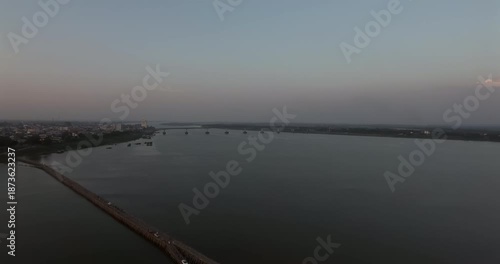 Wallpaper Mural Aerial view flying over the Koh Paen bamboo bridge with the Kizuna concrete bridge in the distance at dusk. Torontodigital.ca