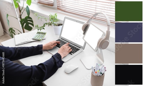 Woman working with laptop a...