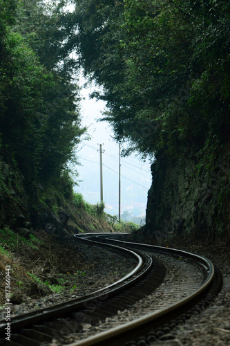 Passenger train traveling on railway tracks