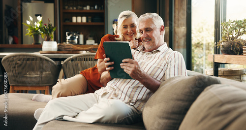 Photos Happy, tablet and senior couple on sofa for subscription, connection and online website in home