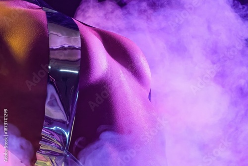 Wallpaper Mural Woman posing with reflective clothing in purple smoke during nighttime in studio Torontodigital.ca