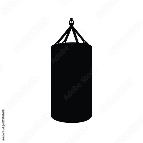 Silhouette of a classic black boxing punching bag hanging in gym